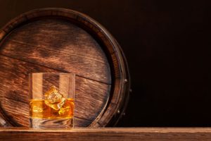 Scotch,Whiskey,Glass,And,Old,Wooden,Barrel.,With,Copy,Space